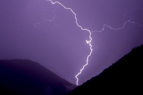 a lightning bolt in the sky at night at Kellnerhof in Nova Levante