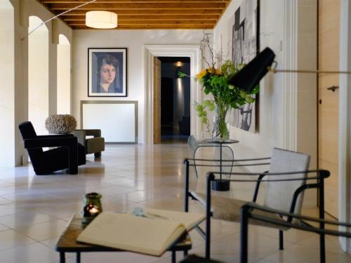 a living room with a couch and a table at La Fiermontina Luxury Home Hotel in Lecce