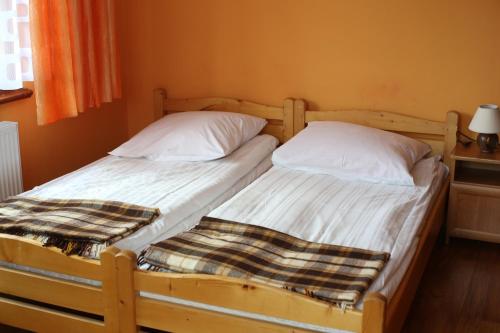 Postel nebo postele na pokoji v ubytování Pokoje Gościnne u Ady