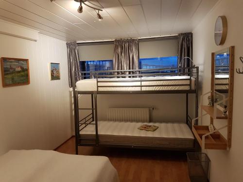 Postel nebo postele na pokoji v ubytování Holiday Guesthouse