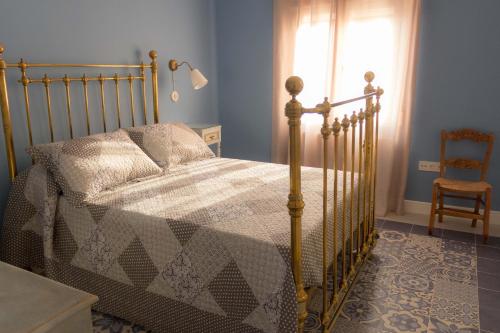 A bed or beds in a room at Casa Rural El Sereno