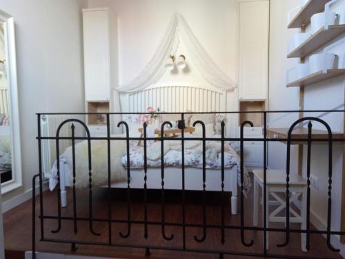 a bedroom with a bed with a white canopy at Casa de Mi Abuela Ribera del Duero in Roa