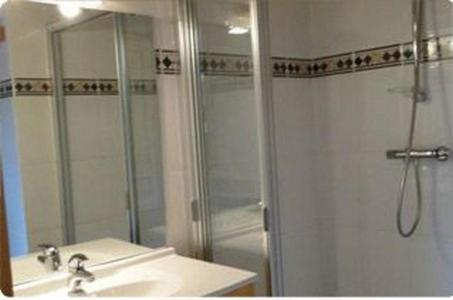 a bathroom with a shower and a sink at Chalet Fleur des Alpes 1 in Les Gets