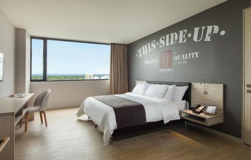 Un ou plusieurs lits dans un hébergement de l'établissement Hotel Sites Montería
