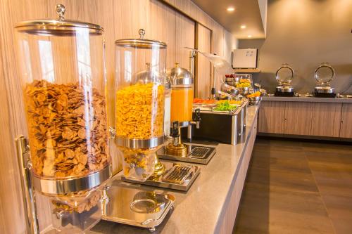 a buffet line in a restaurant with some food at City Express Plus by Marriott Ciudad de México Mundo E in Mexico City