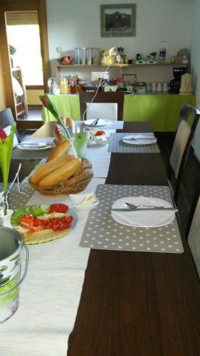 a table with plates of food on top of it at Villa Gold in Nová Lesná