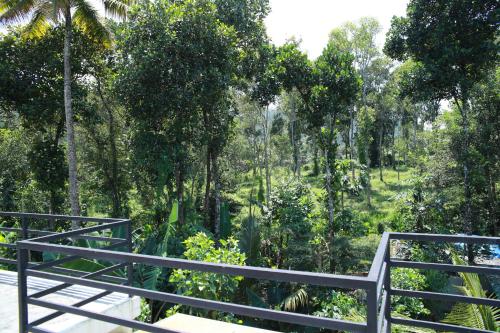 a view of a forest from a bridge at Periyar Villa Home Stay - Thekkady in Thekkady