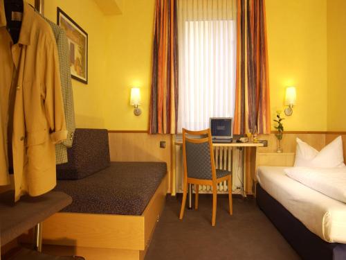 Postel nebo postele na pokoji v ubytování City Partner Hotel Strauss