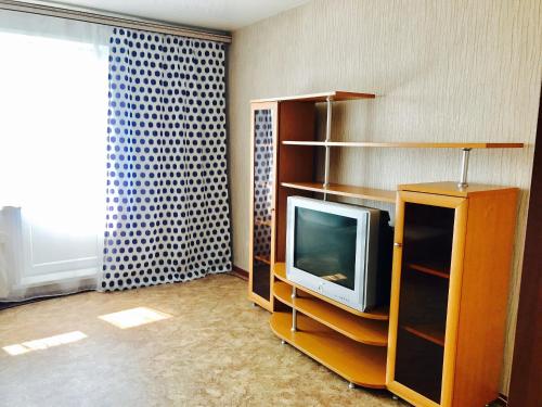 En tv och/eller ett underhållningssystem på Апартаменты на Советской 63