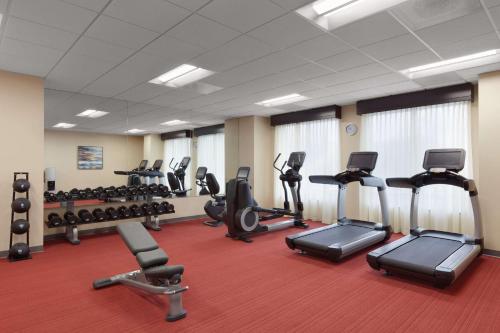 a gym with several treadmills and cardio machines at Hyatt Place St. Louis/Chesterfield in Chesterfield