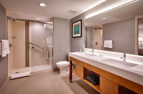 a bathroom with a sink and a toilet and a shower at Hyatt Place Salt Lake City/Lehi in Lehi