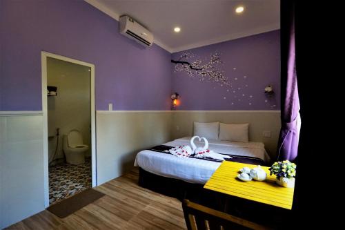Postel nebo postele na pokoji v ubytování Q Songchi Hotel