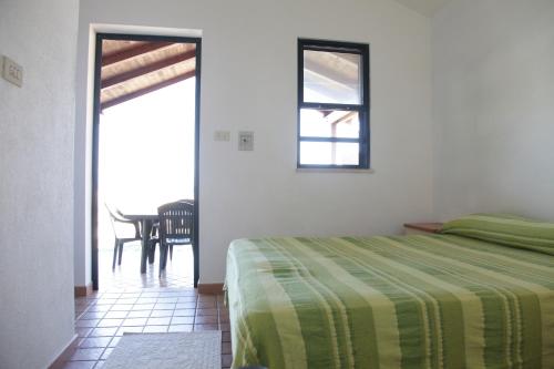 Кровать или кровати в номере Camping Golfo dell'Asinara