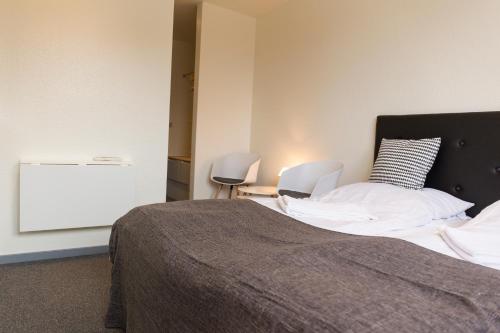 Postel nebo postele na pokoji v ubytování Fjordlyst Hotel