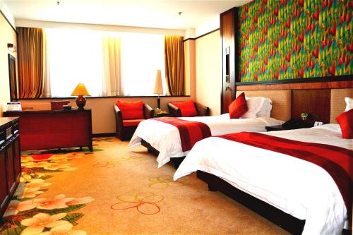 Un pat sau paturi într-o cameră la Riyuegu Hotsprings Resort