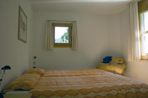 A bed or beds in a room at Ferienwohnung Mura