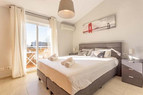 Posteľ alebo postele v izbe v ubytovaní Atico La Caleta