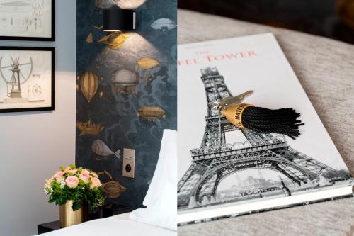a book with a picture of the eiffel tower at Hôtel Mathis Elysées in Paris