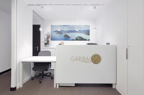 an office with a white desk with a sign on it at Pensión Garibai in San Sebastián