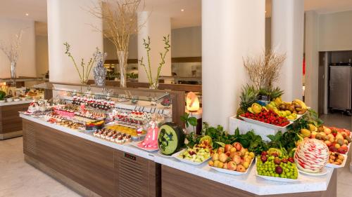 a buffet line with fruits and vegetables on display at Julian Club Hotel in Marmaris