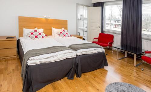 Säng eller sängar i ett rum på Alsterbro Minihotell