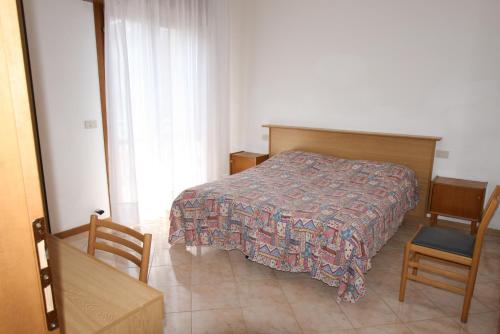 A bed or beds in a room at Condominio York