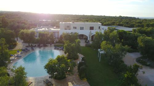 an aerial view of a house with a swimming pool at Isola Verde Agriturismo in Carovigno