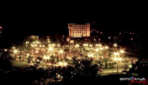a city lit up at night with lots of lights at Guest Rooms Profirov in Zlatograd