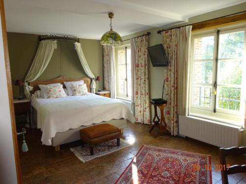 Katil atau katil-katil dalam bilik di Moulin de Sévoux