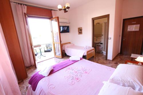 Postel nebo postele na pokoji v ubytování A Casa Di Gabri
