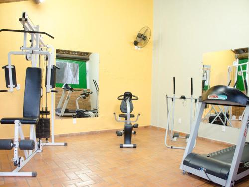 a gym with several exercise equipment in a room at Ville Park Hotel in Ourinhos