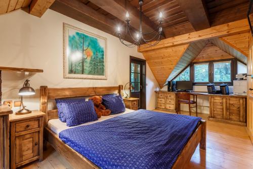 a bedroom with a bed with a teddy bear on it at Medvědí skála in Čeladná