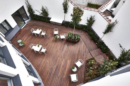 an overhead view of a patio with tables and chairs at Hygge Hotel in Brussels