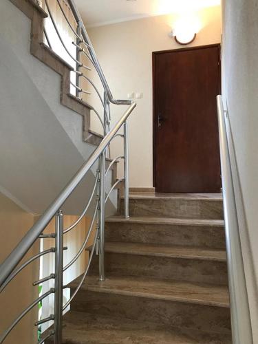 a set of stairs with a door in a building at Guest Rooms Profirov in Zlatograd