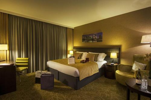 Ένα ή περισσότερα κρεβάτια σε δωμάτιο στο Hotel Vikrant