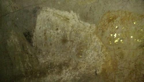 a painting of a face on a wall at Salsa Hostel in Chumphon