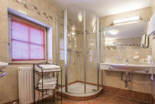 a bathroom with a shower and a sink at Haus Ennsblick in Flachau