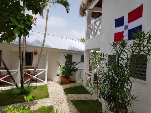 a flag on the side of a building at Bayahibe Guest House Hotel in Bayahibe