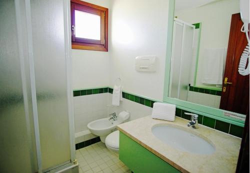 Kylpyhuone majoituspaikassa Residence Liscia Eldi