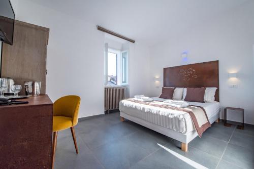 Postel nebo postele na pokoji v ubytování Hotel Assisivm Antica Dimora AD