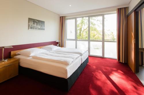 Säng eller sängar i ett rum på Aparion Apartments Berlin