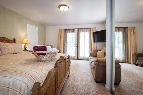 a bedroom with a large bed and a couch at Rental In Tahoe in South Lake Tahoe