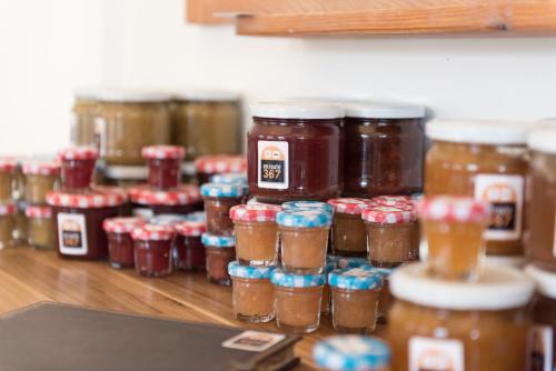 a group of jars of jam on a table at Enroute367 in Varsenare