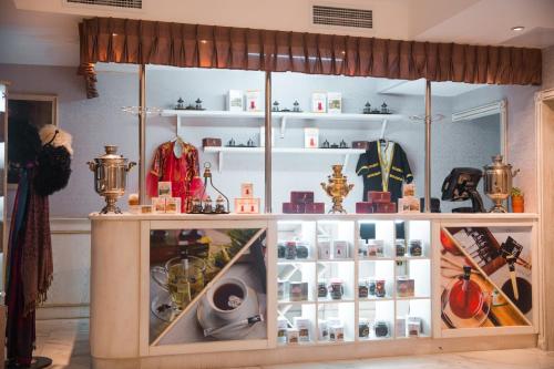 a display case in a store with a lot of items at Boutique Hotel Baku in Baku