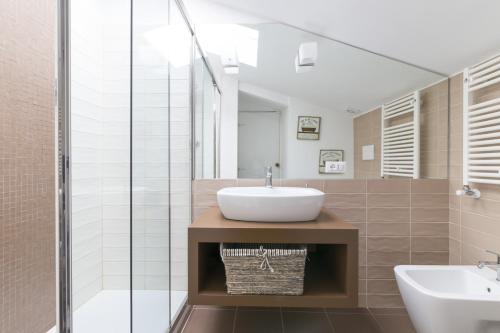a bathroom with a sink and a shower at Residence SanMarco in Venice