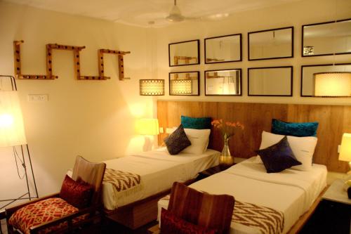 Ein Bett oder Betten in einem Zimmer der Unterkunft Hotel Villa Highnest - Oragadam -Sriperumbudur