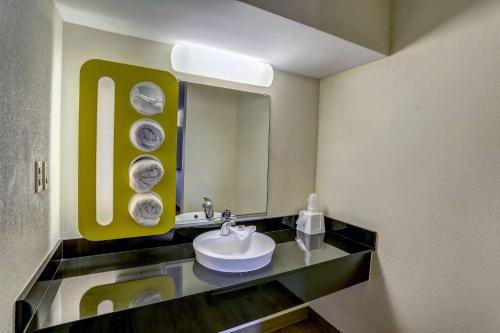 a bathroom with a sink and a mirror at Motel 6-Dickson, TN in Dickson
