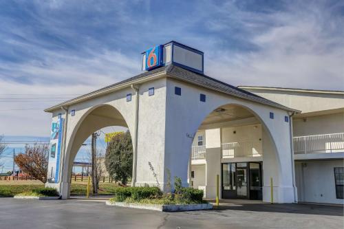 a building with a clock on top of it at Motel 6-Dickson, TN in Dickson