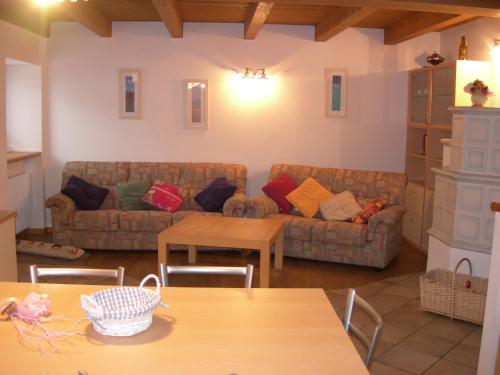 a living room with a couch and a table at Appartamento Alessia in Varena