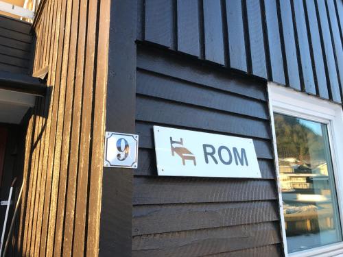 a sign on the side of a building with a ron sign at Villa Åndalsnes in Åndalsnes